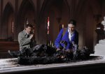 BONES:  Brennan (Emily Deschanel, R) and Booth (David Boreanaz, L) arrive at a church to investigate the remains of a man resembling the devil in the BONES episode "The Devil in the Details" airing Thursday, Feb. 4 (8:00-9:00 PM ET/PT) on FOX.  ©2010 Fox Broadcasting Co.  Cr:  Greg Gayne/FOX